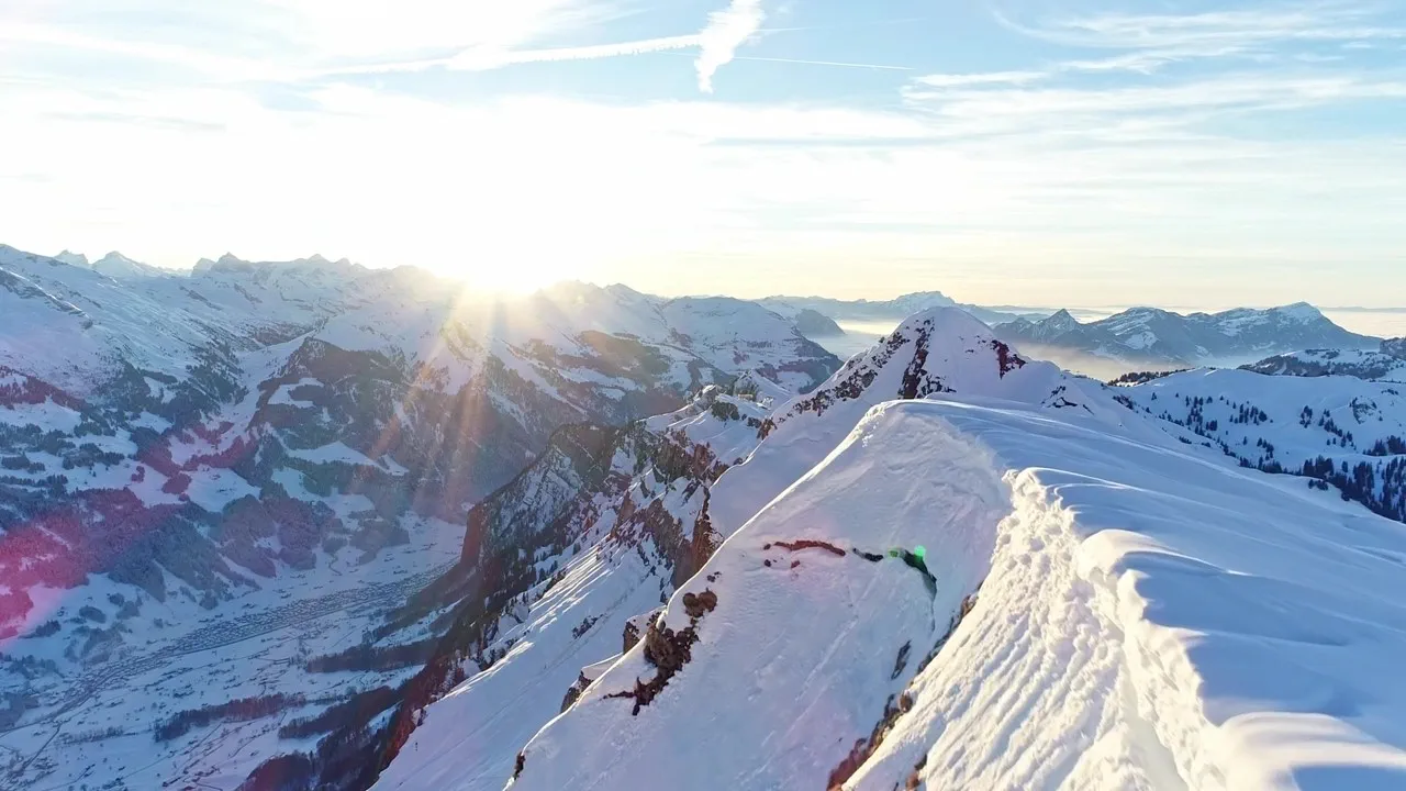 A panoramic view of snow-capped mountains represents the global reach and impressive heights achieved by the newly promoted partners and counsel at global law firm Hogan Lovells